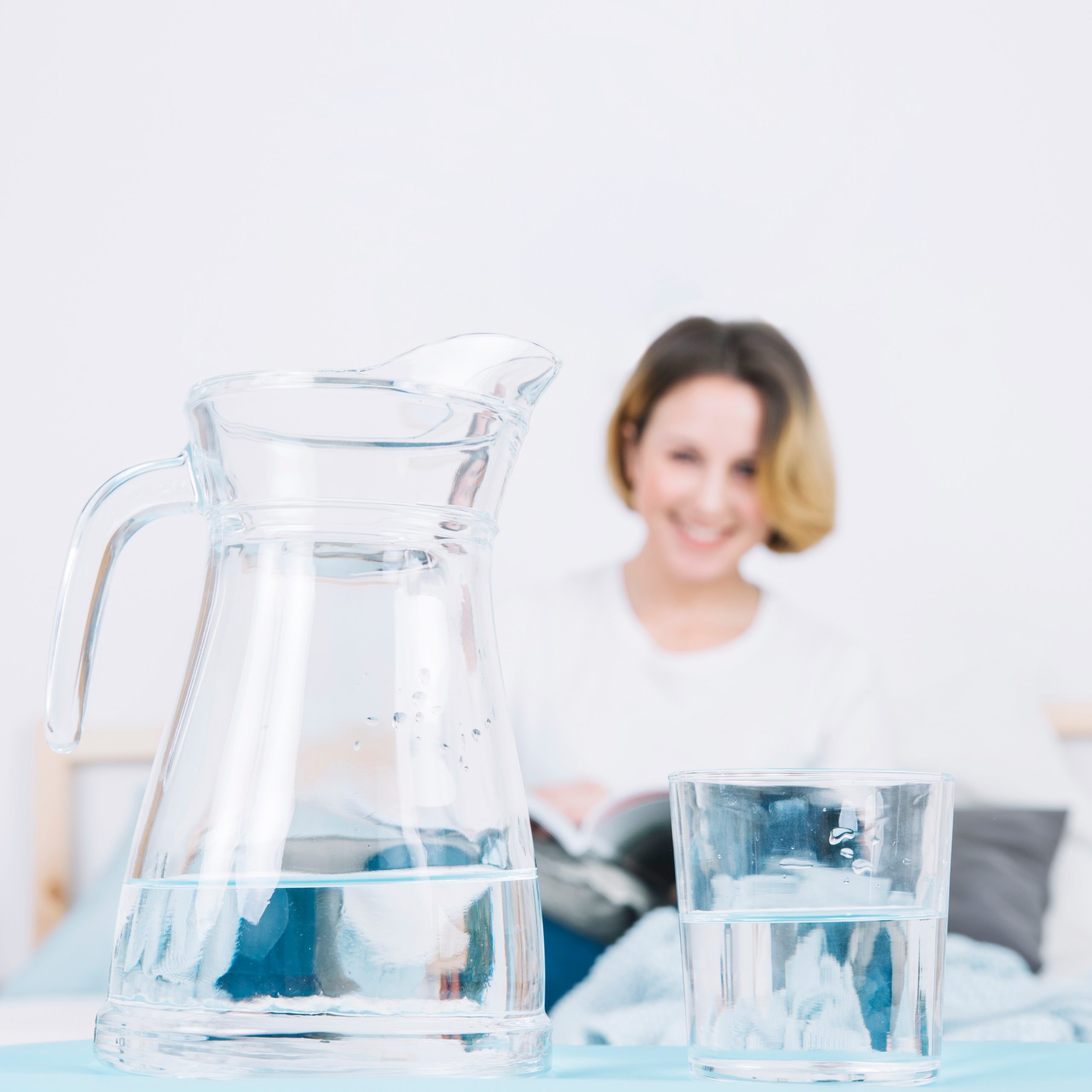 jug-glass-near-reading-woman-11zon